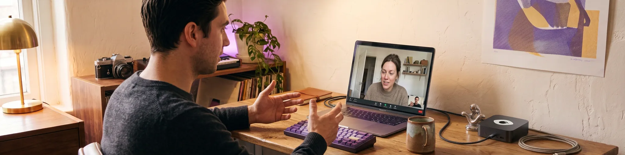 A person at their desk on a video call with a colleague — a human in the loop